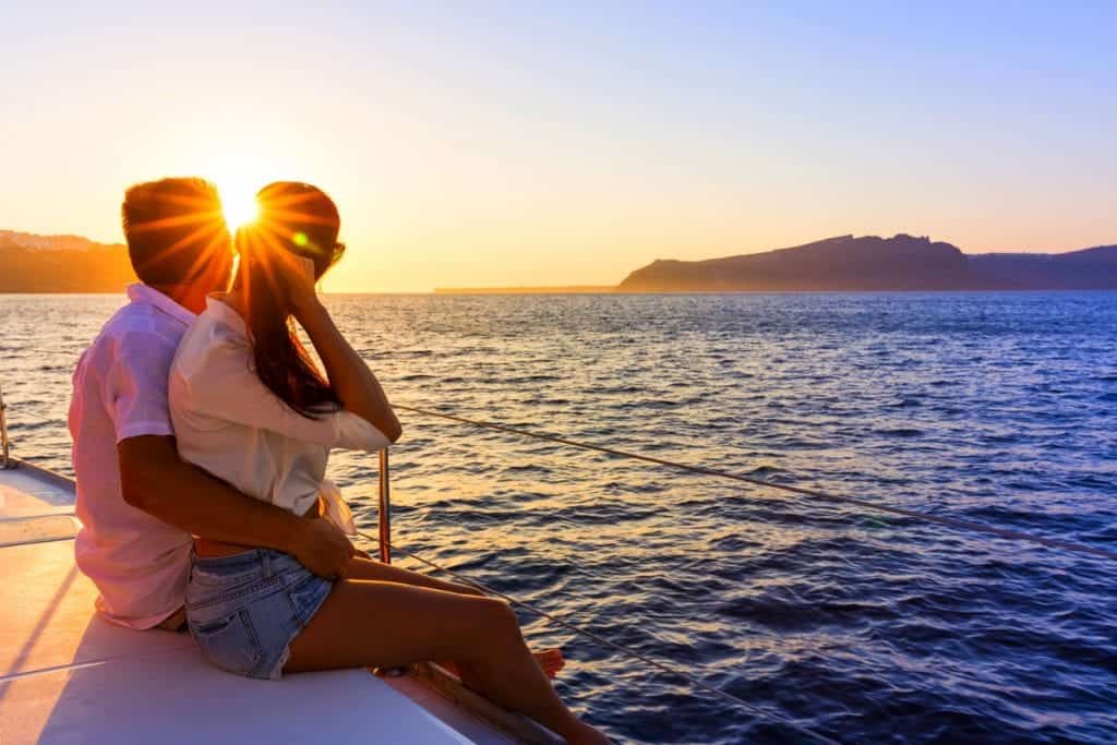 Romantic couple on yacht at sunset yacht holiday deals